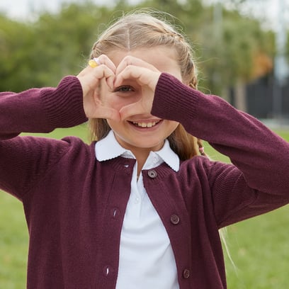 girl wearing a burgundy cardigan sweater 