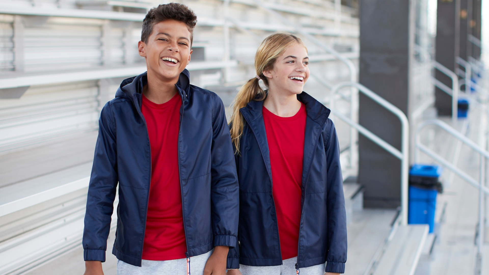 two kids outside wearing layers